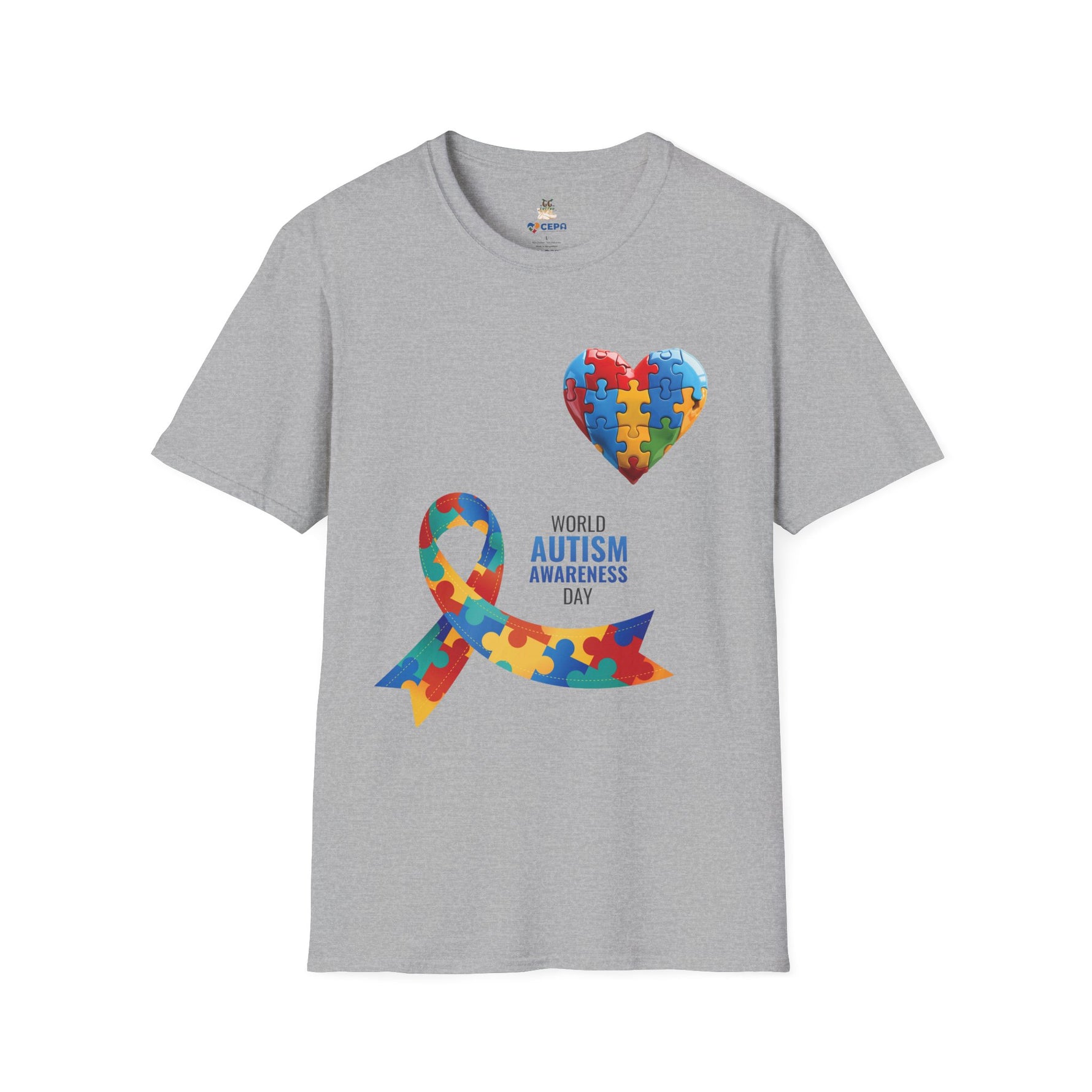 Gray t-shirt featuring a colorful heart made of puzzle pieces and a multicolored puzzle ribbon with the word “Autism,” symbolizing autism awareness, love, and inclusion.