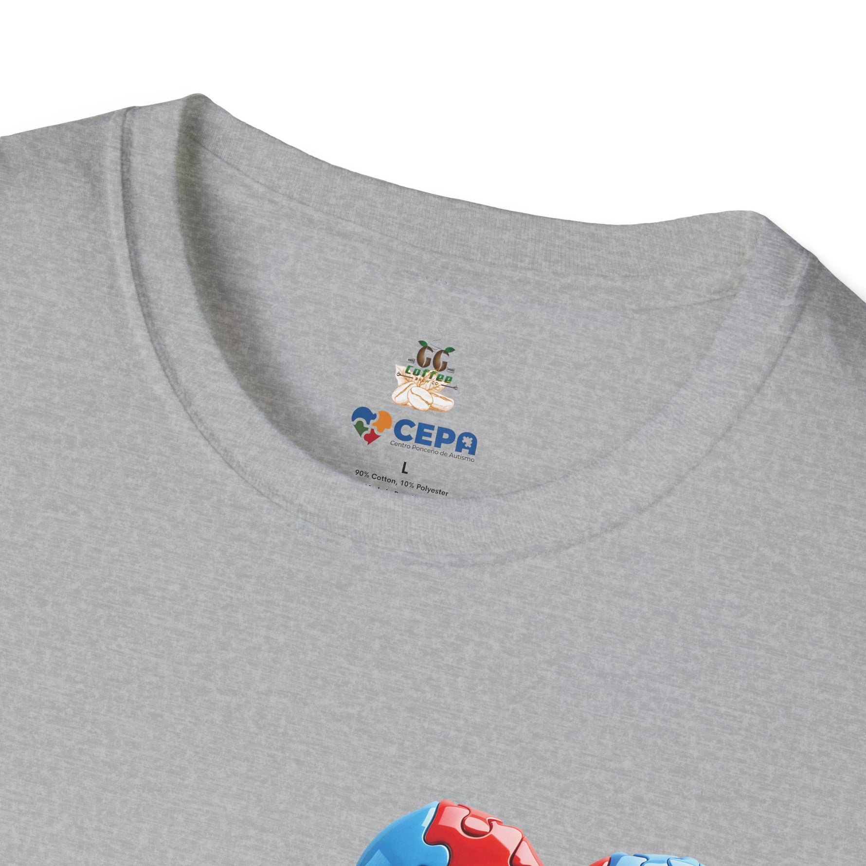Close-up of a Gray t-shirt showing the GG Coffee Brew Co. and CEPA logo near the collar, representing autism awareness and inclusion.