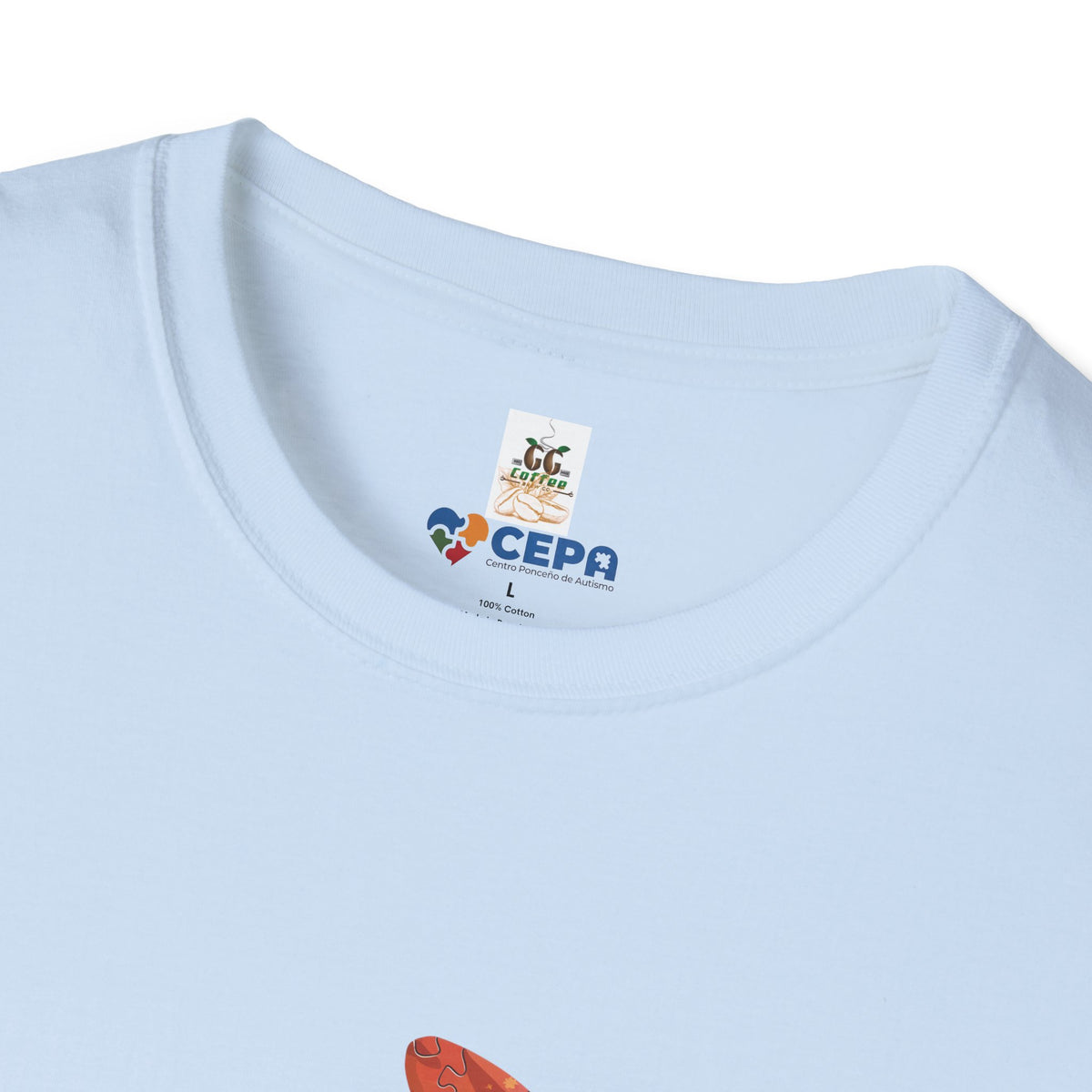 Close-up of a light blue t-shirt showing the GG Coffee Brew Co. and CEPA logo printed near the collar, representing support for autism awareness and inclusion.