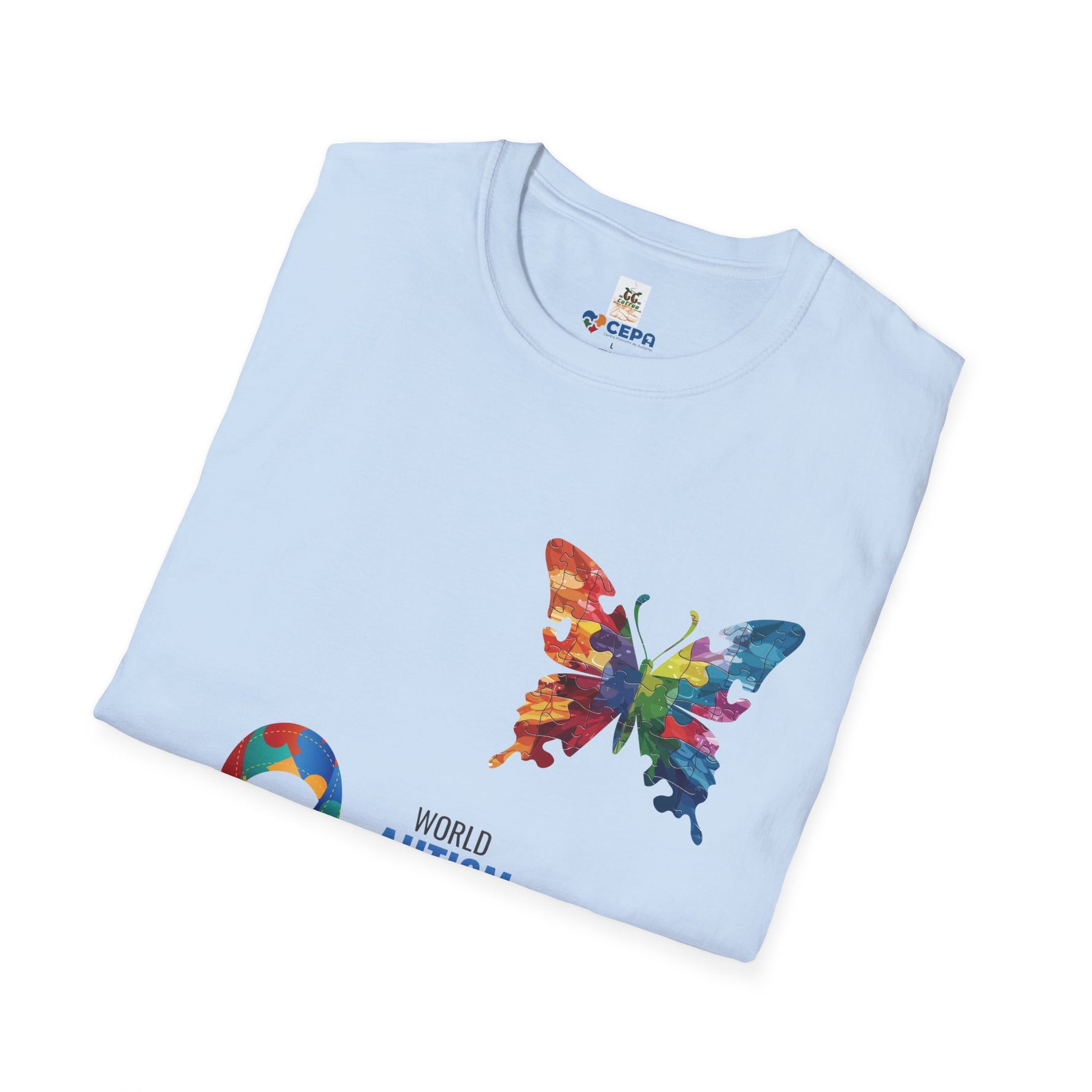 Folded light blue t-shirt featuring a colorful butterfly and puzzle piece design with the CEPA and GG Coffee Brew logos, symbolizing autism awareness and inclusion.