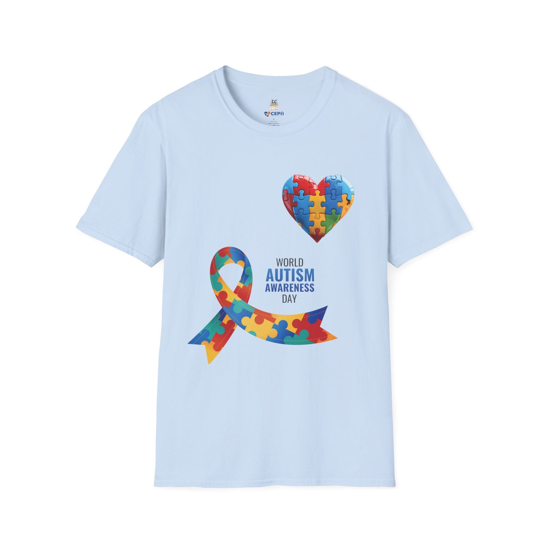 Light blue t-shirt featuring a colorful heart made of puzzle pieces and a multicolored puzzle ribbon with the word “Autism,” symbolizing autism awareness, love, and inclusion.