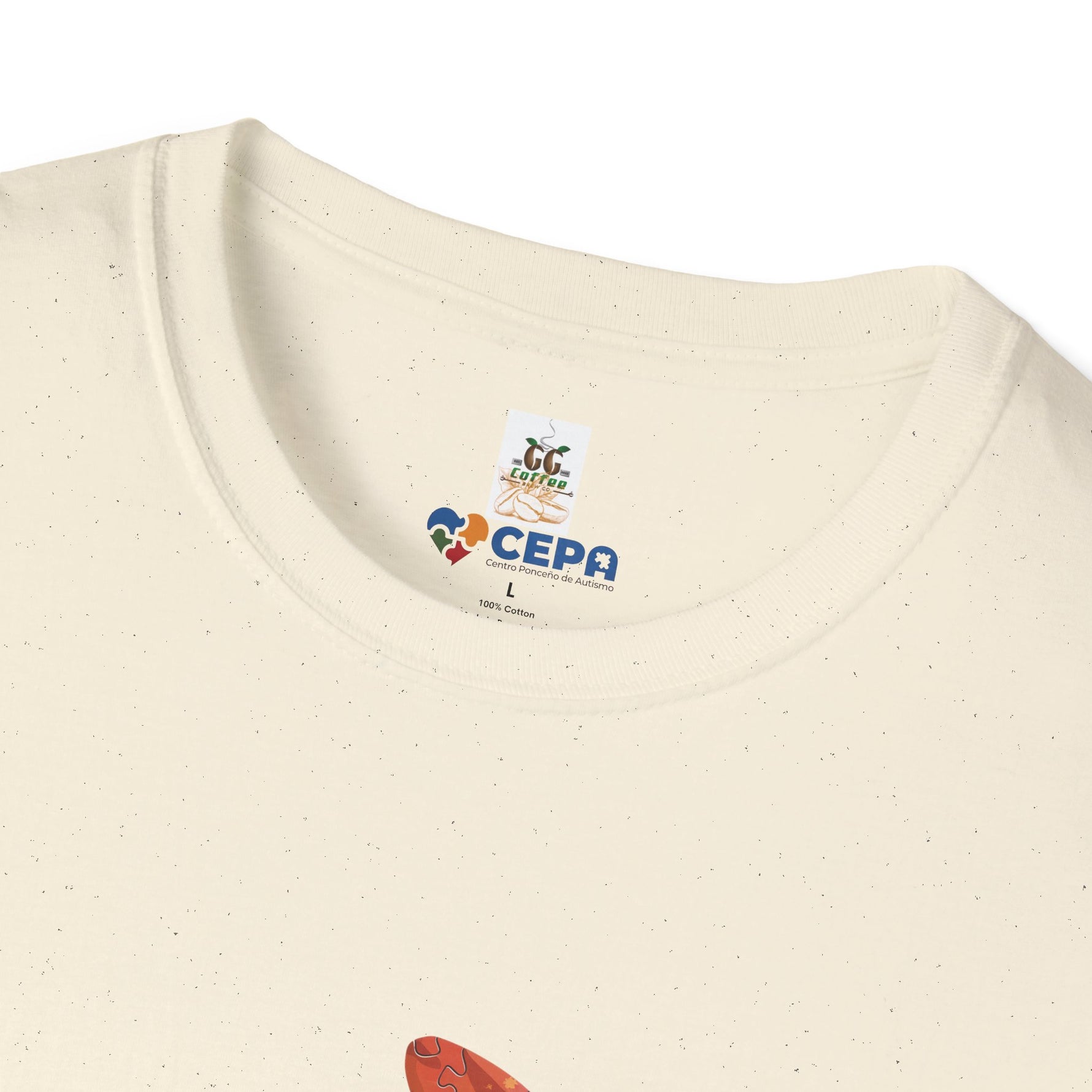 Close-up of a Natural t-shirt showing the GG Coffee Brew Co. and CEPA logo printed near the collar, representing autism awareness and support for inclusion.