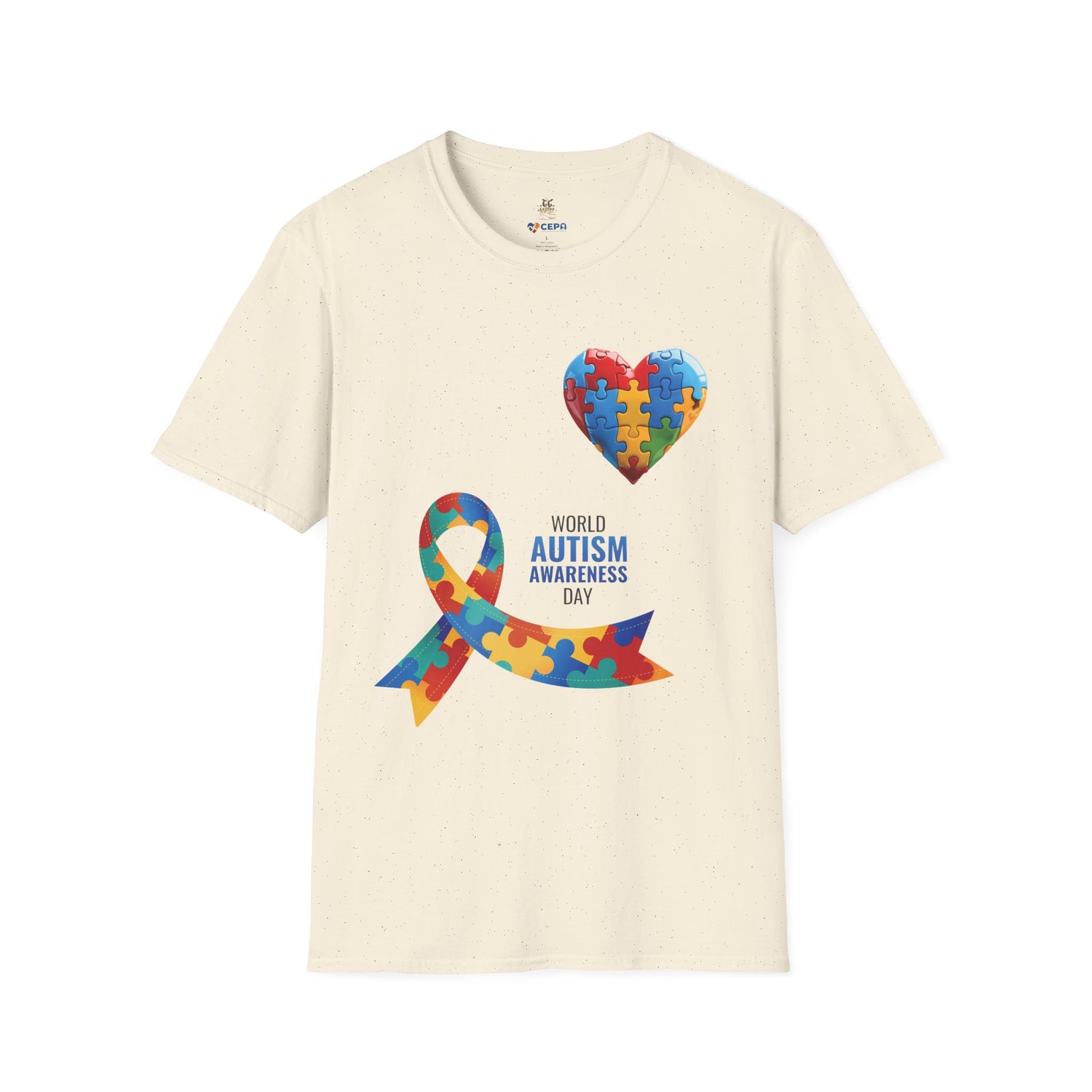 Natural t-shirt featuring a colorful heart made of puzzle pieces and a multicolored puzzle ribbon with the word “Autism,” symbolizing autism awareness, love, and inclusion.