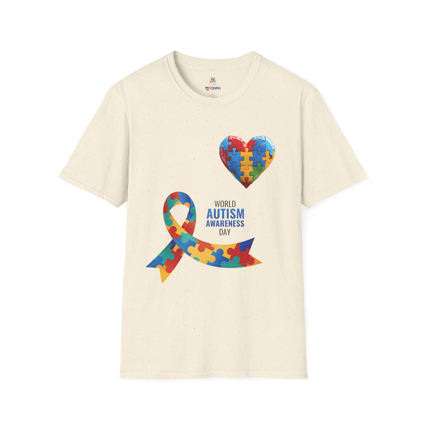 Natural t-shirt featuring a colorful heart made of puzzle pieces and a multicolored puzzle ribbon with the word “Autism,” symbolizing autism awareness, love, and inclusion.