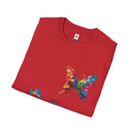 Folded red t-shirt featuring a vibrant multicolored butterfly and puzzle piece design, symbolizing autism awareness and inclusion.
