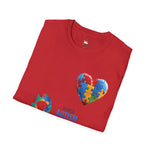 olded red t-shirt featuring a colorful heart made of puzzle pieces with the word “Autism,” symbolizing autism awareness, love, and inclusion.