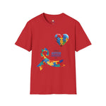 Red t-shirt featuring a colorful heart made of puzzle pieces and a multicolored puzzle ribbon with the word “Autism,” symbolizing autism awareness, love, and inclusion.