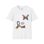 White t-shirt featuring a colorful butterfly and multicolored puzzle ribbon design with the word “Autism,” representing autism awareness and inclusion.