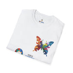 Folded white t-shirt featuring a vibrant multicolored butterfly with puzzle pattern design and the CEPA logo near the collar, symbolizing autism awareness and inclusion.