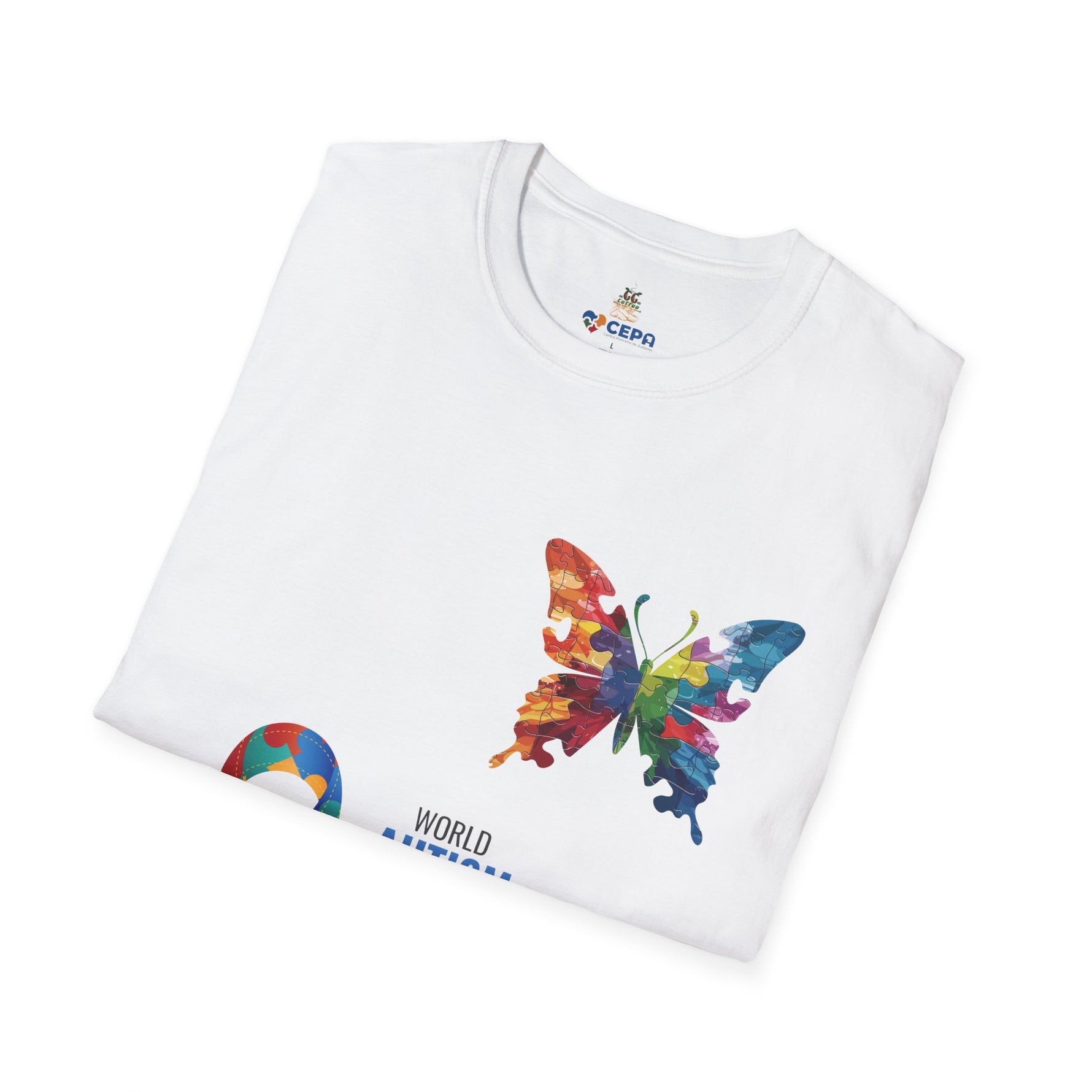 Folded white t-shirt featuring a vibrant multicolored butterfly with puzzle pattern design and the CEPA logo near the collar, symbolizing autism awareness and inclusion.