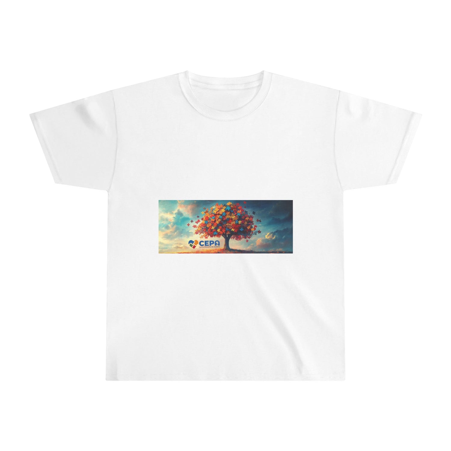 White t-shirt featuring a vibrant colorful tree made of puzzle pieces with a blue sky background and CEPA logo, symbolizing autism awareness and inclusion.