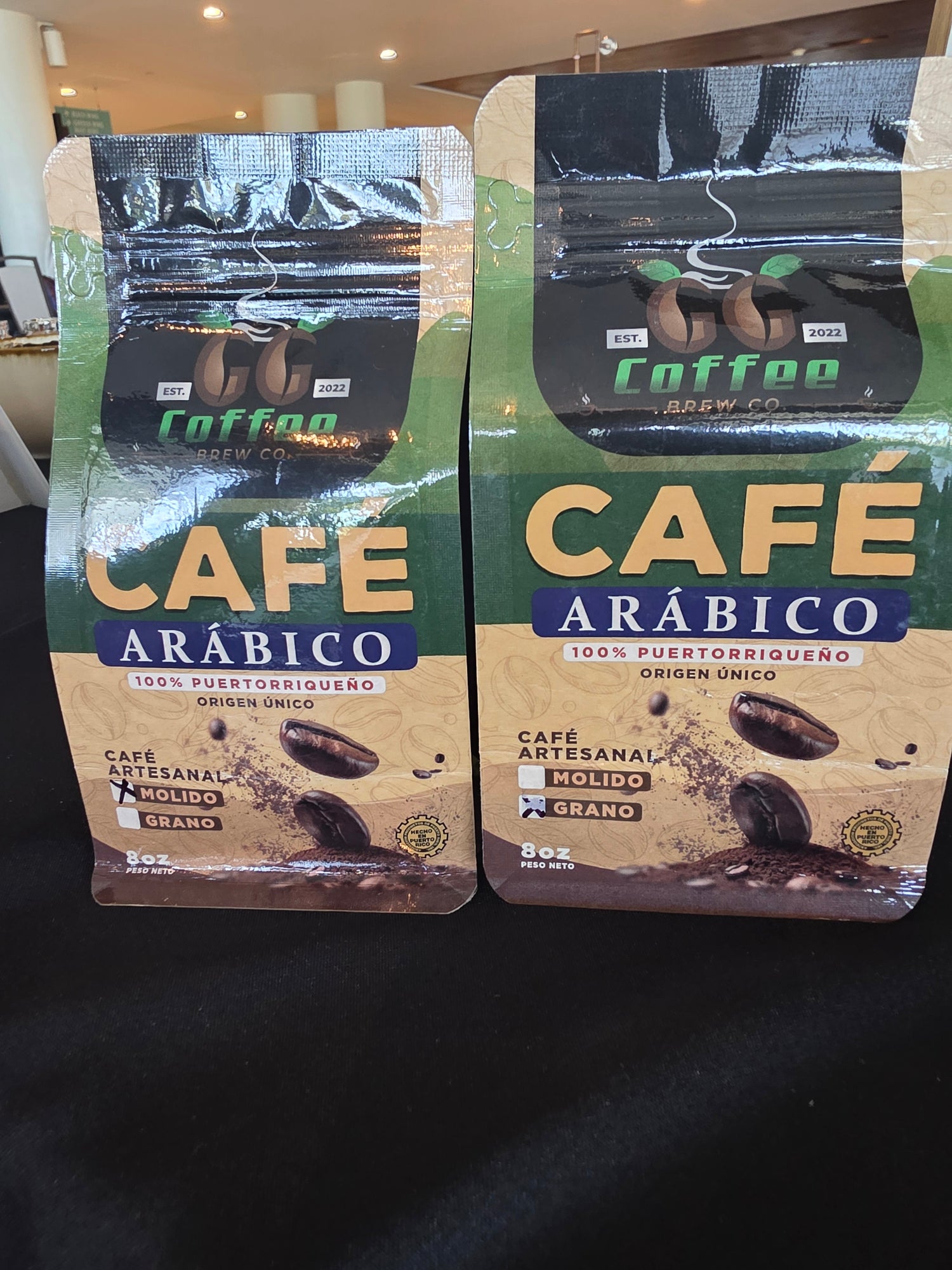 Two 8-ounce bags of GG Dual premium Arabica coffee, highlighting fresh, balanced flavors for coffee lovers.